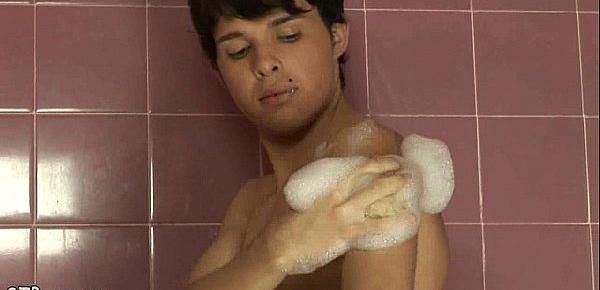  Nude boy having fun stroking off in a bubble bath